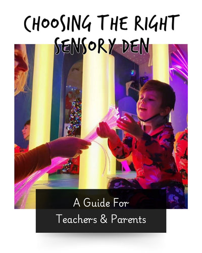 a child in a sensory room enjoying the bubble tube and fibre optic lights