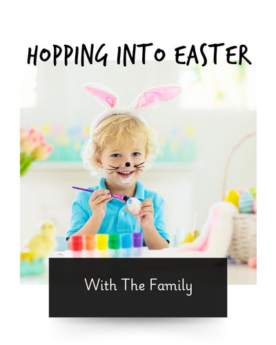 a young child with face paints as a bunny rabbit, whilst wearing bunny ears celebrating Easter, and painting eggs