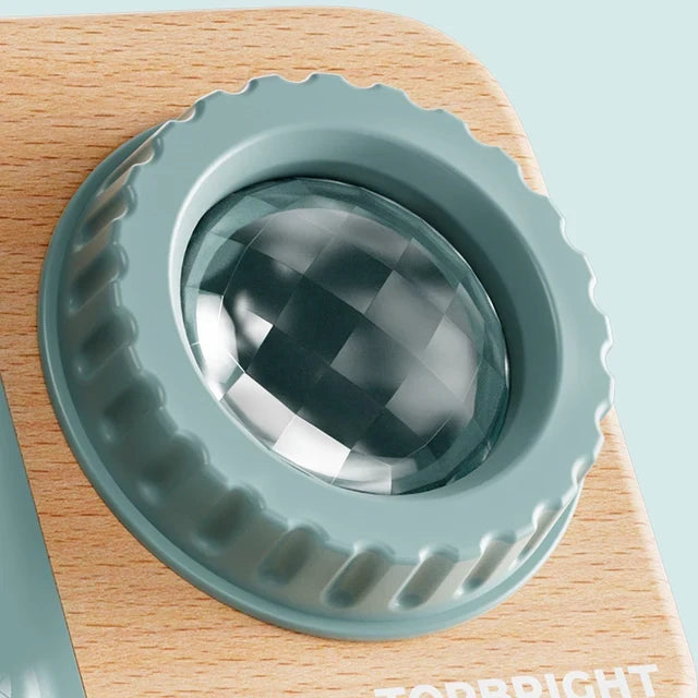 Close-up of the Busy Camera’s faceted kaleidoscope lens and ridged rotating surround