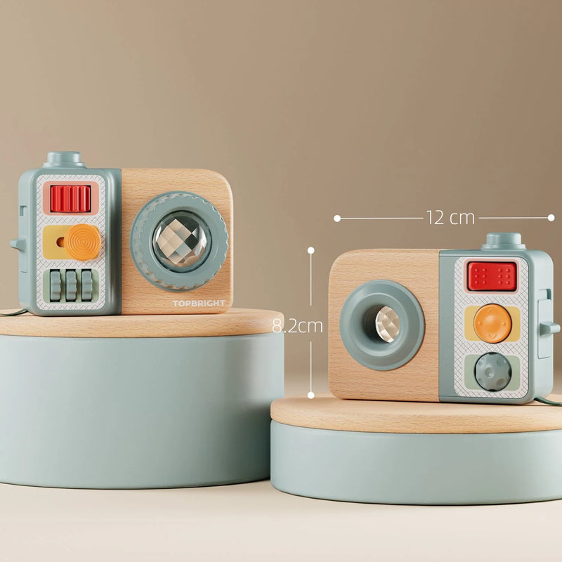 Front and reverse views of the Busy Camera, with dimensions marked as 12 cm wide and 8.2 cm high
