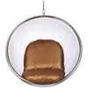 A modern hanging bubble chair with a clear acrylic or glass spherical shell, a polished silver metal frame, and a plush cushioned seat and back in a warm brown satin fabric, suspended by a chain against a plain white background.