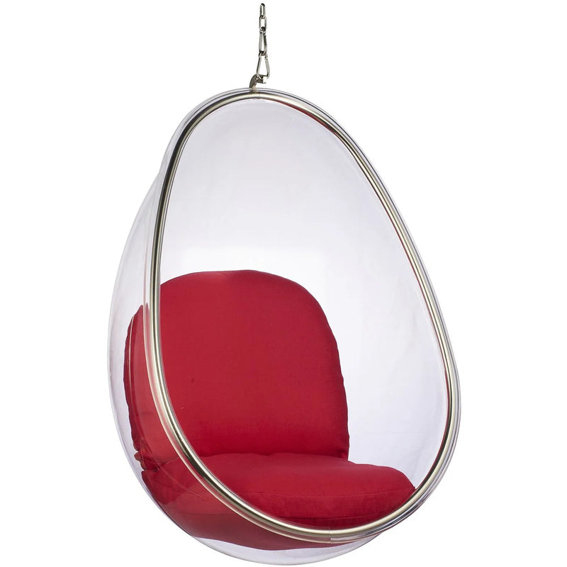 A modern teardrop-shaped hanging egg chair with a clear transparent shell, a silver metal frame, and plush red cushions inside, suspended by a chain against a white background.