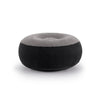 A donut-shaped inflatable lounge chair or ottoman in two-tone gray and black, shown on a clean white background.