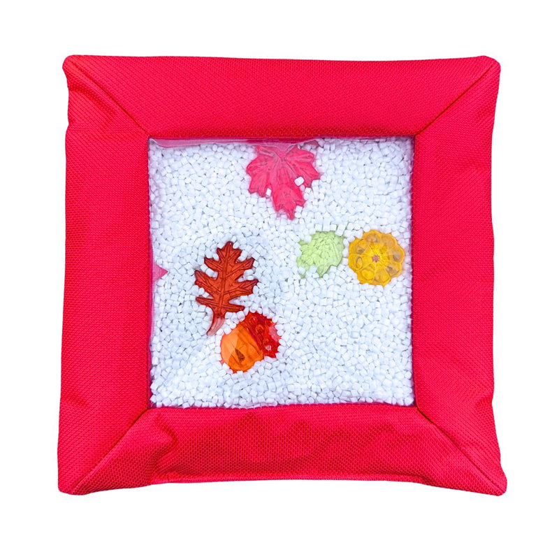 Red Sensory Touch and Search Bag with leaf-shaped objects visible through the window