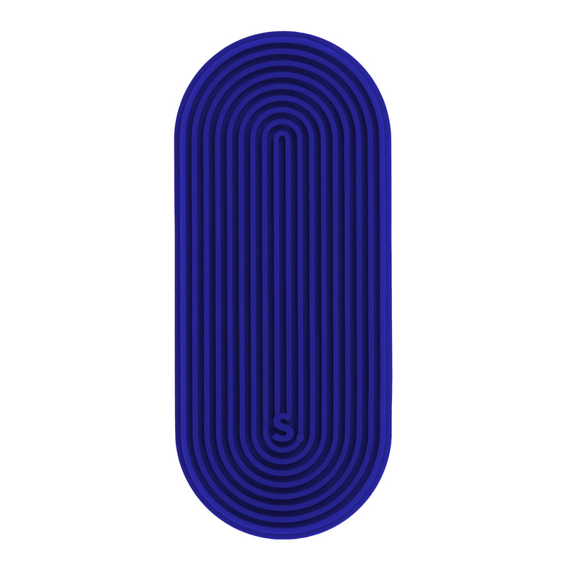Close-up of a navy oval ridged Speks Slabs silicone sensory sticker on a white background
