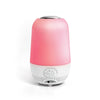 A pink and white cylindrical lamp with a glowing pink top section and a white bottom control base, shown on a clean white background.